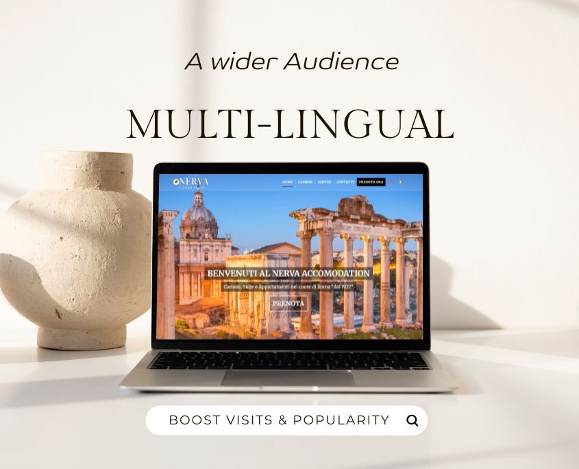 Desk with ceramic pot & laptop showing multi-lingual hotel website in Rome